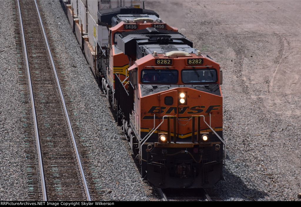 BNSF 8282 and 5456 higball below bridge in Petrified Forrest